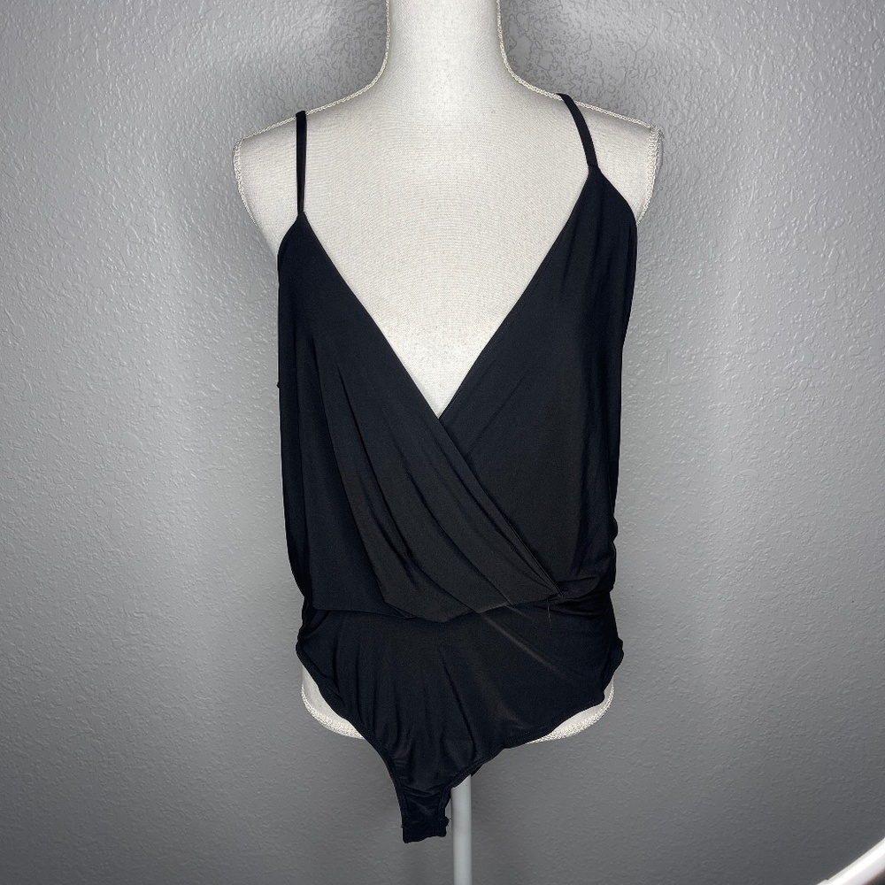 Black bodysuit with low scoop‎ neck front
